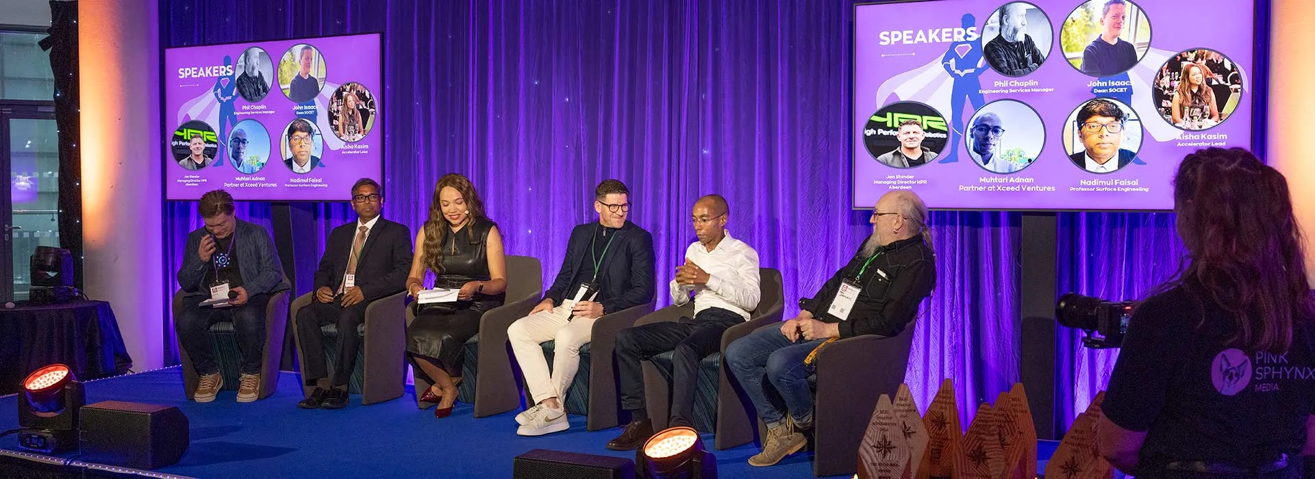 audience listening to a panel at startup showcase event