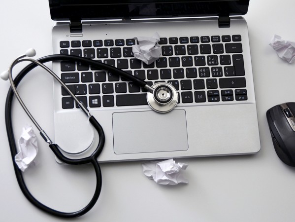 a laptop with a stethoscope