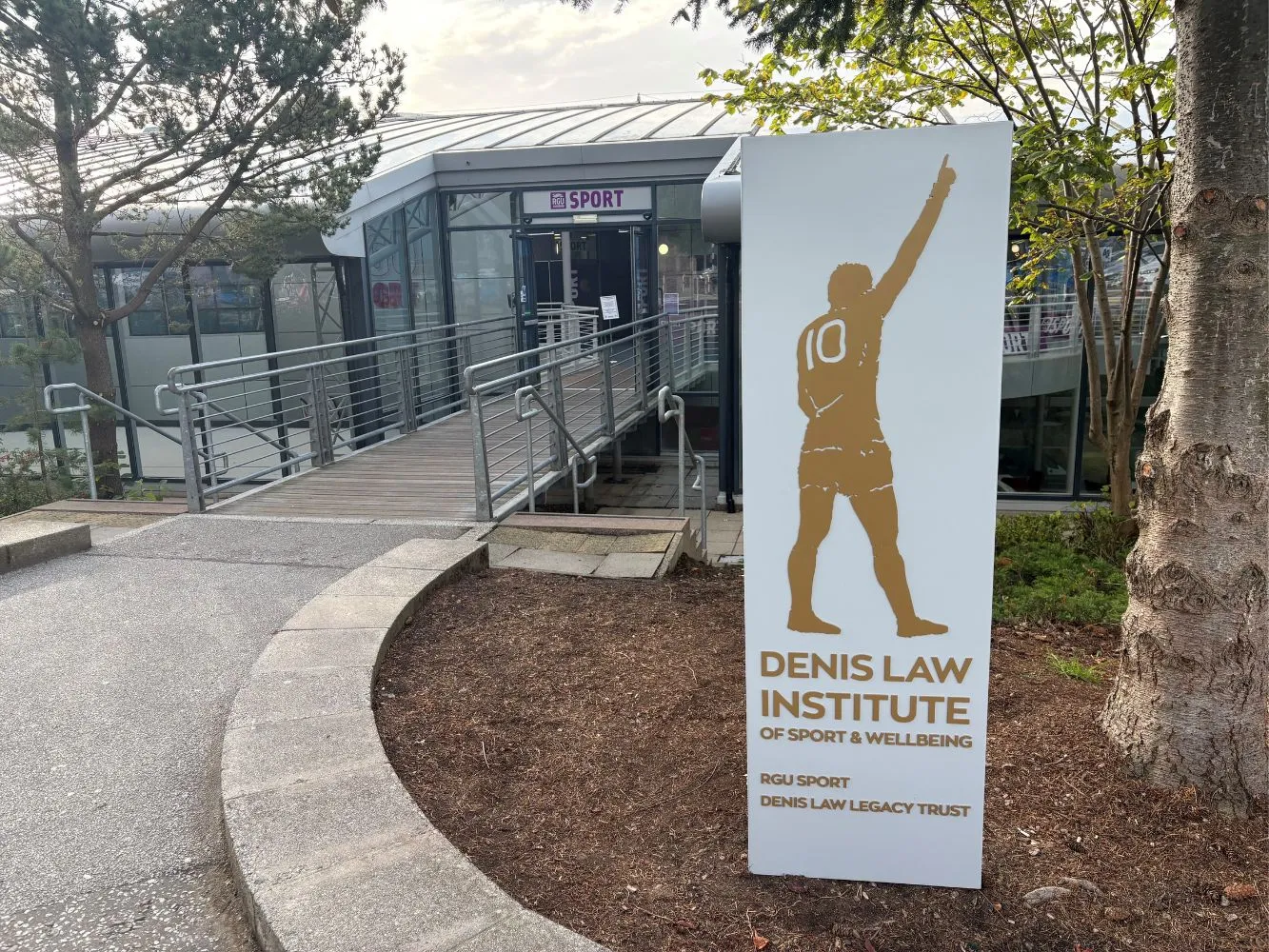 A sign for the Denis Law Institute for Sport and Wellbeing