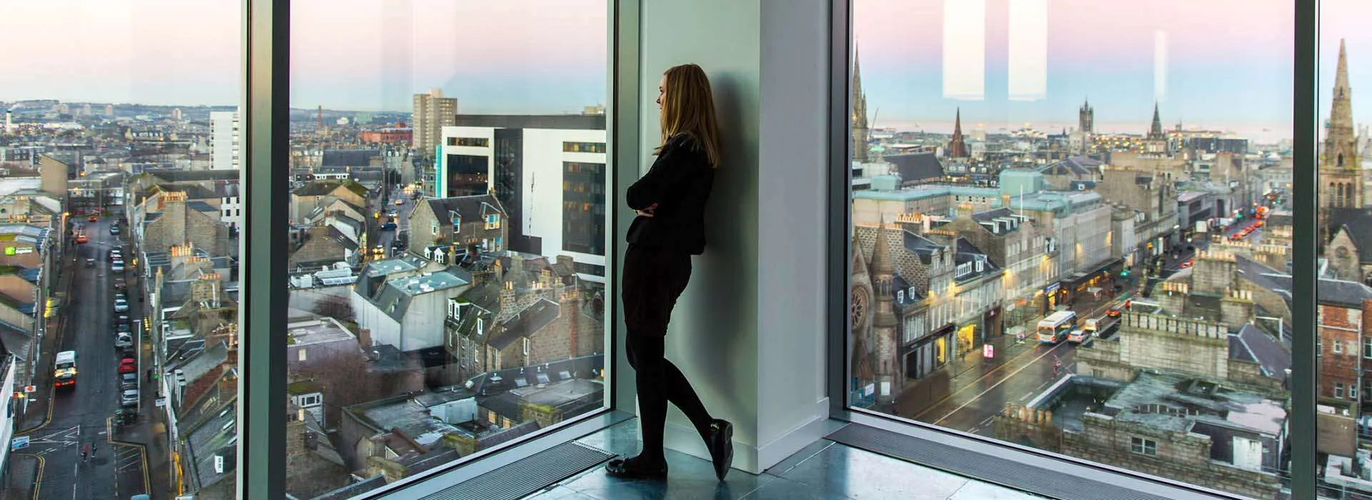 woman looking out over aberdeen skyline