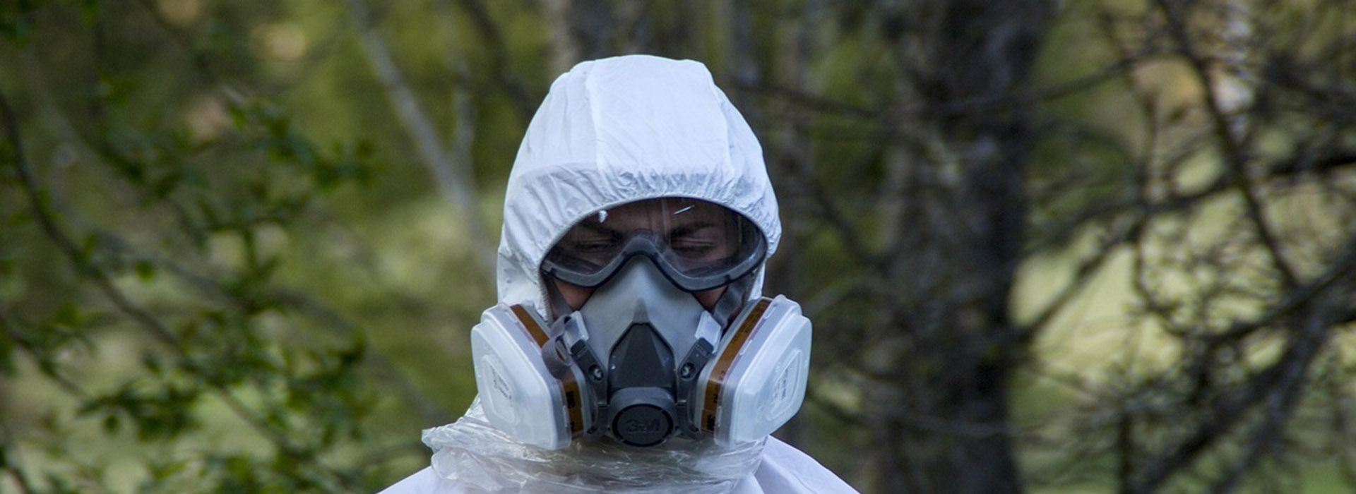 Person in protective clothing and mask