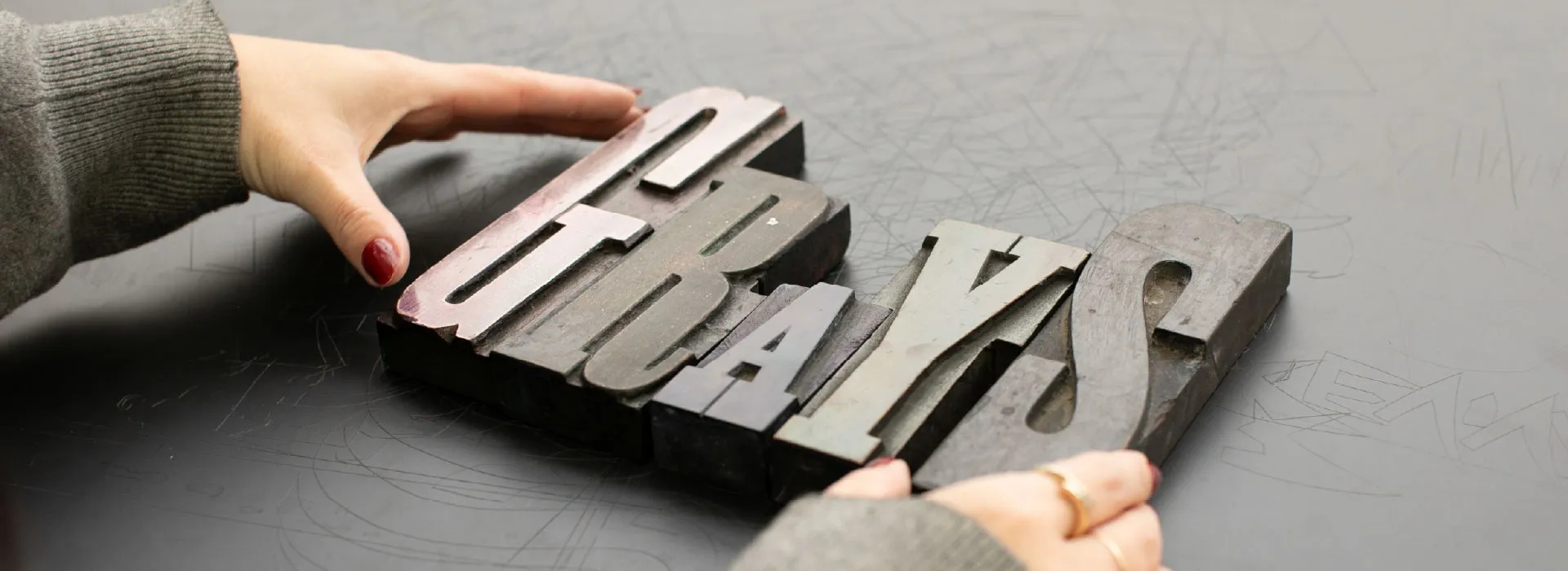 letterpress letters spelling out the word Grays