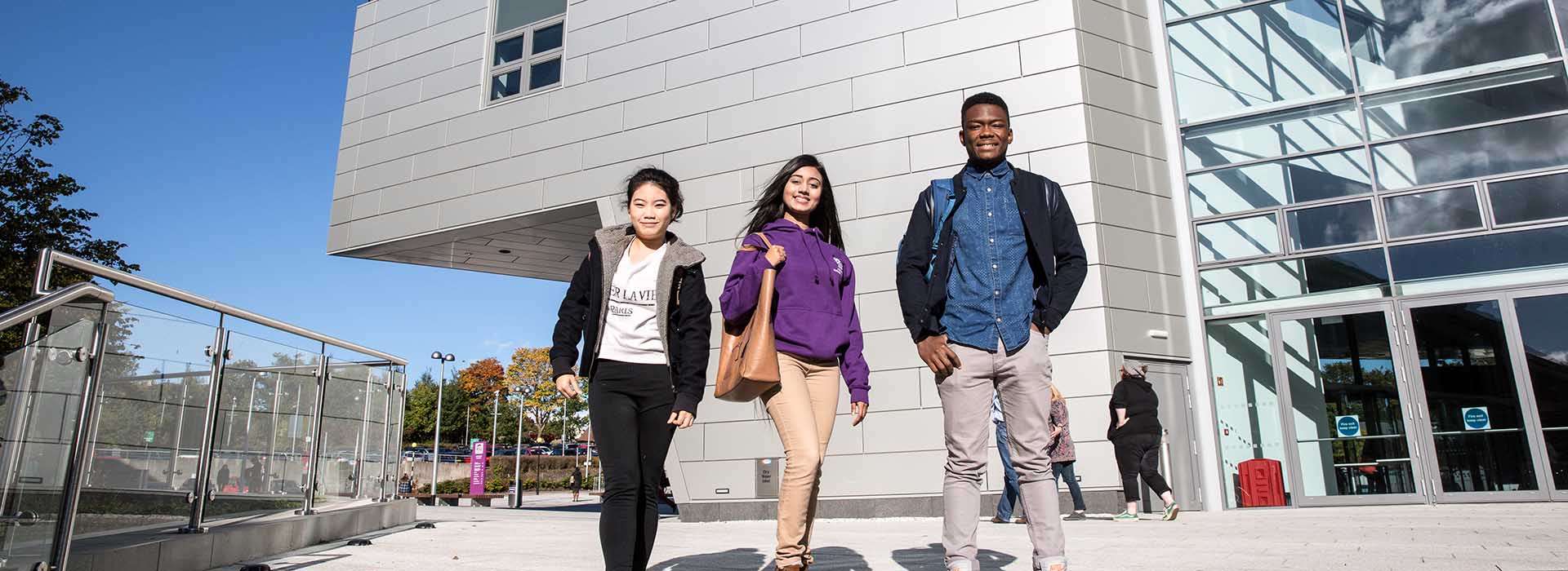 students walking beside the sir ian wood building on rgu campus