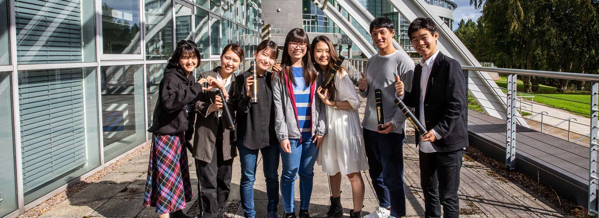 smiling japanese students on rgu campus