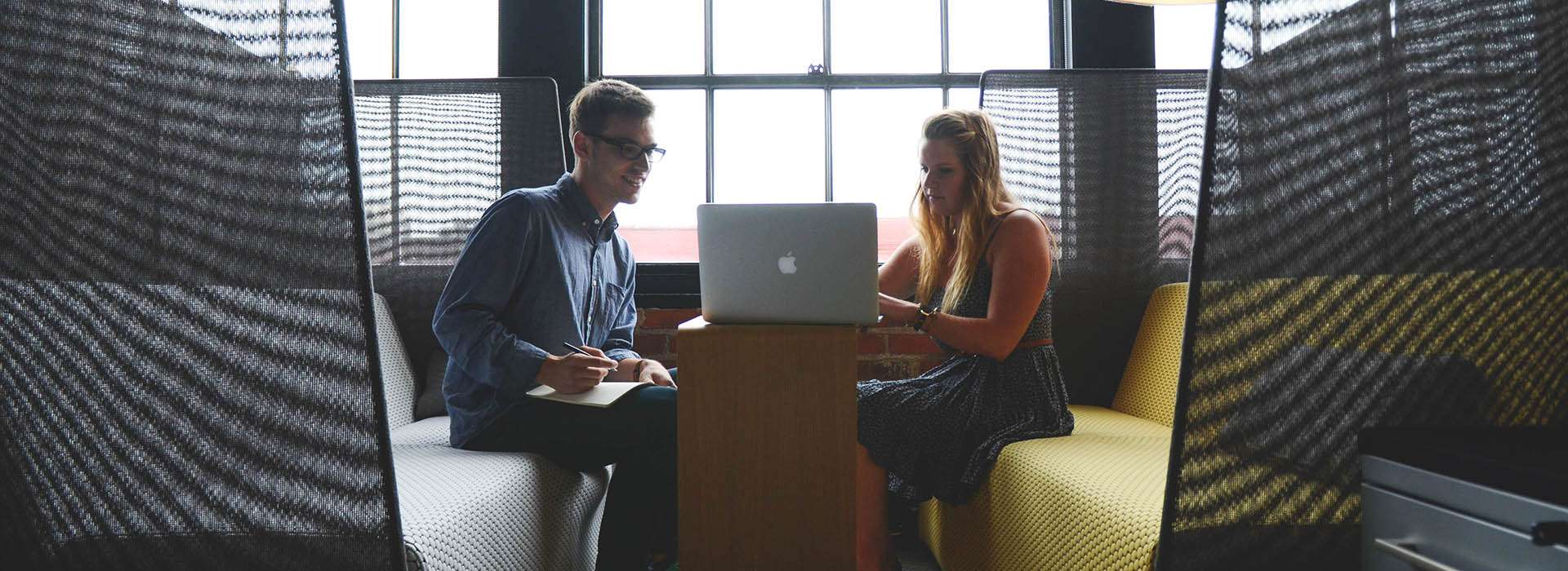students chatting in a study pod