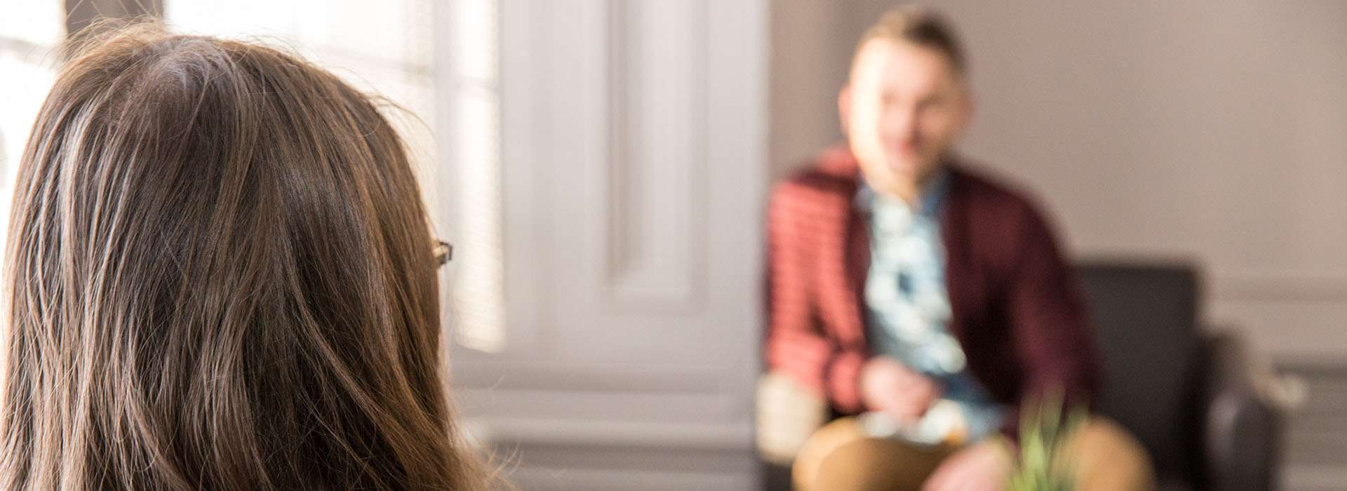 blurry image of two people having a conversation