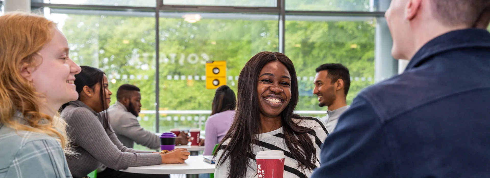 students smiling in the canteen area