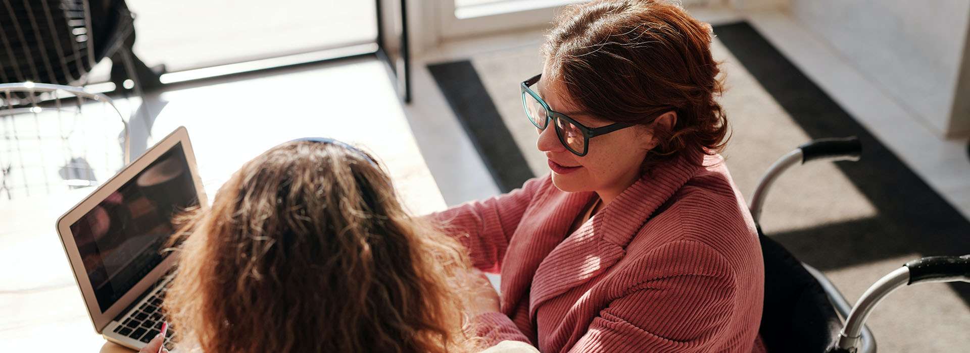 woman in wheelchair in a meeting woman in wheelchair in a meeting