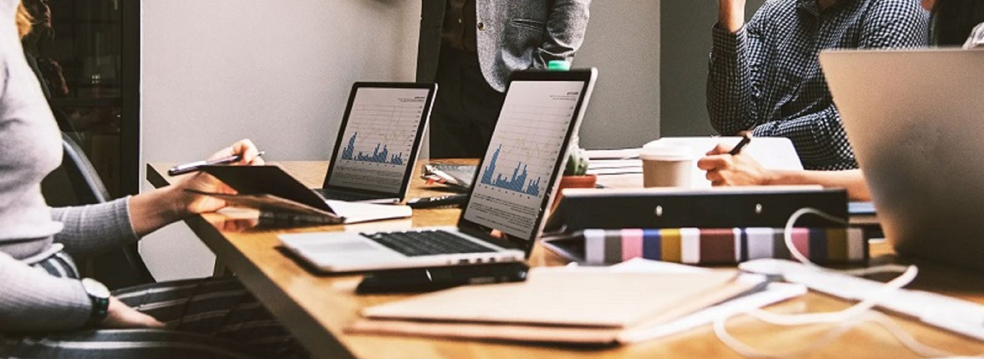 People at a meeting with laptops