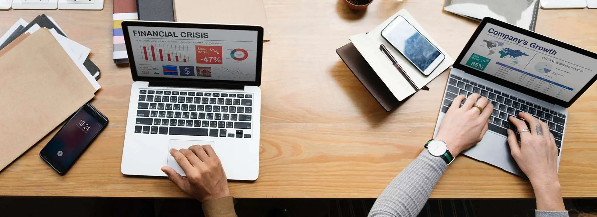 people using laptops on a desk