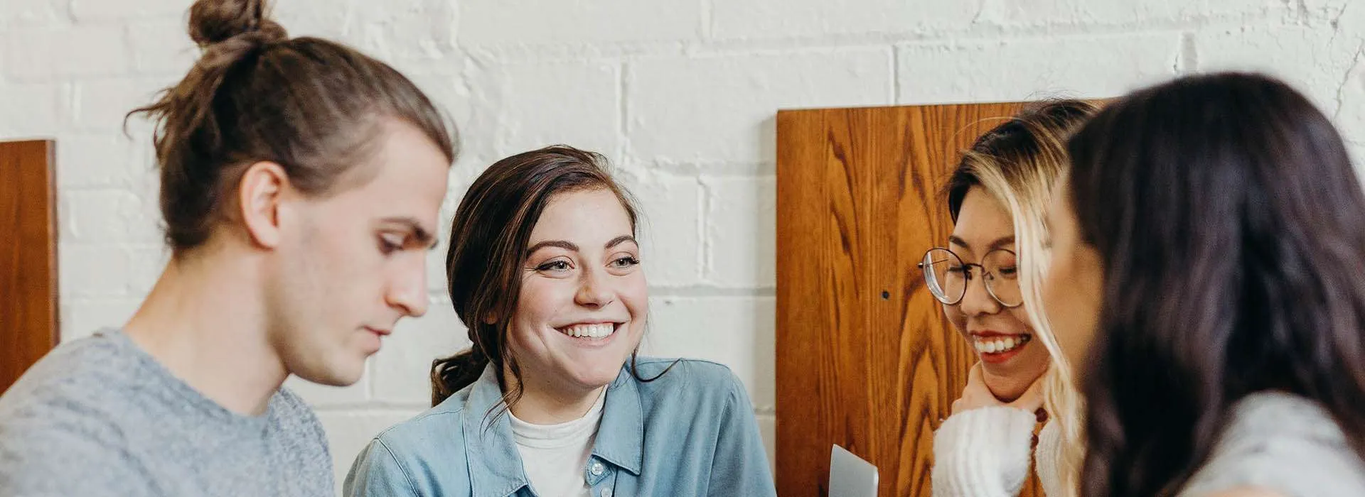 group of people chatting around a table