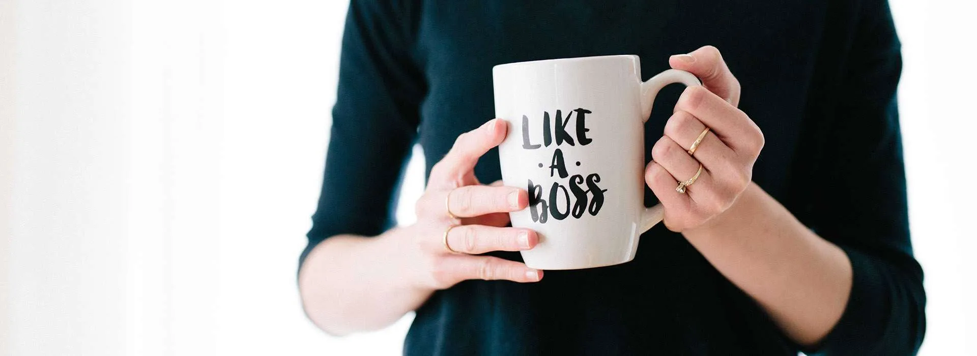 woman holding a mug that says