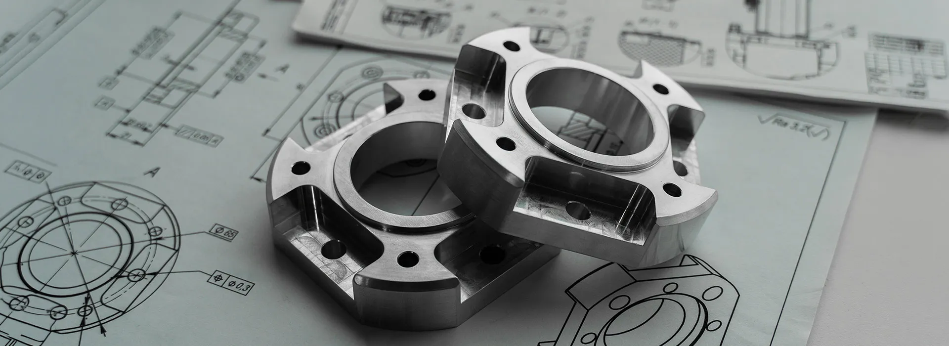 metal gearing sat on some drawn engineering diagrams