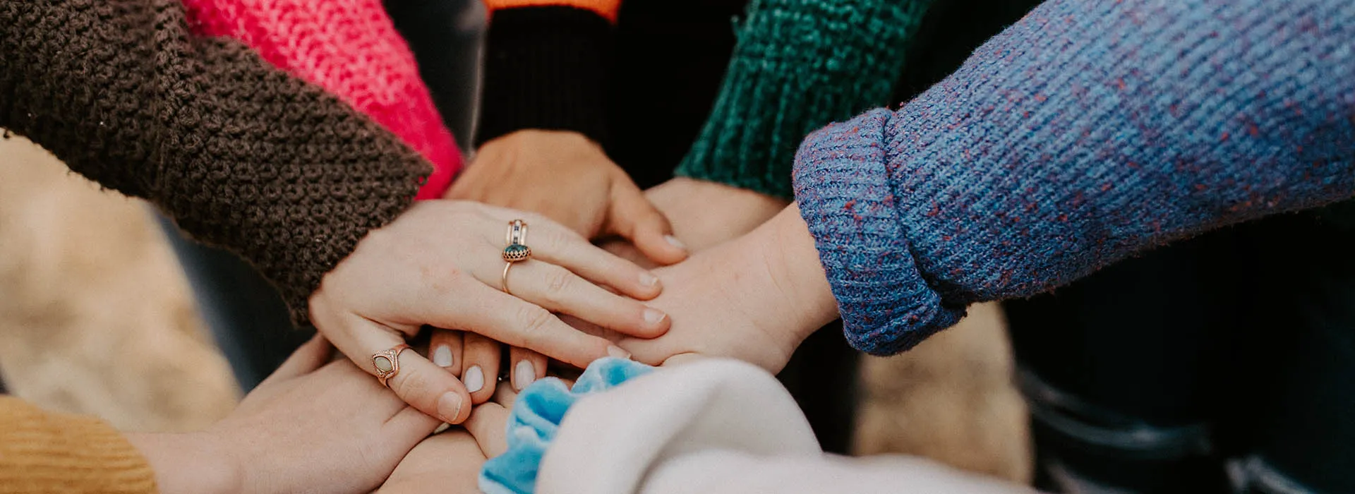 people putting their hands together