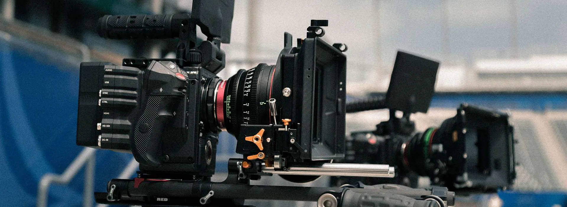 two professional camera rigs set up on tripods