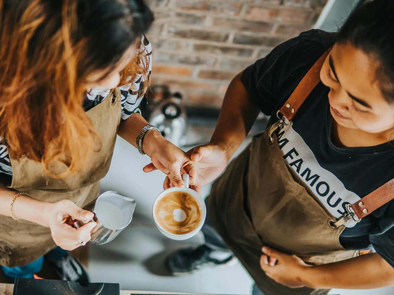 barista's make a latte in a coffee shop