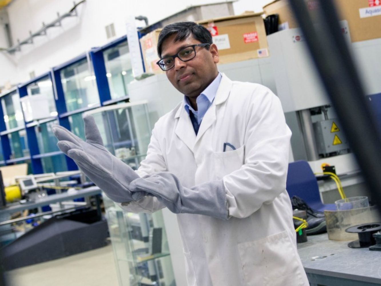 Prof Nadimul Haque Faisal posing with a pair of gloves