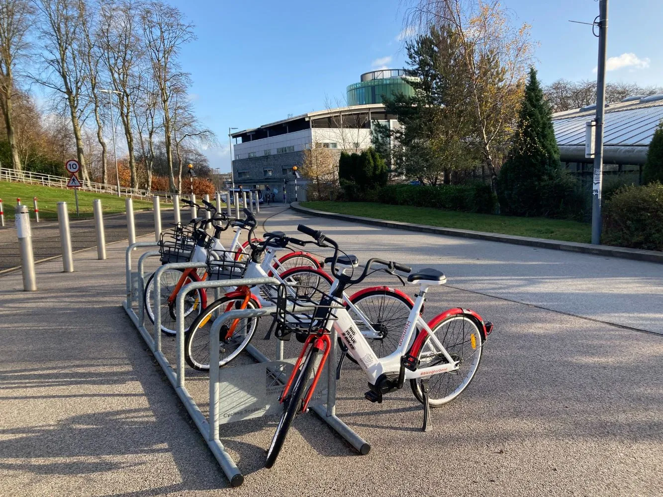 The red and white eBikes on RGU's campus.