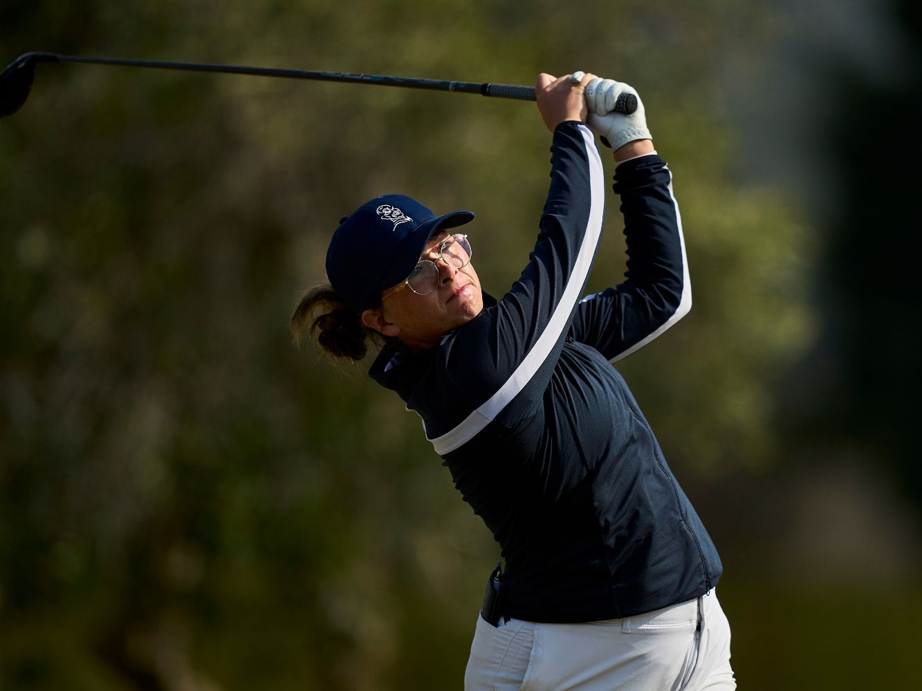 Robyn Fowlie after hitting a shot on a golf course