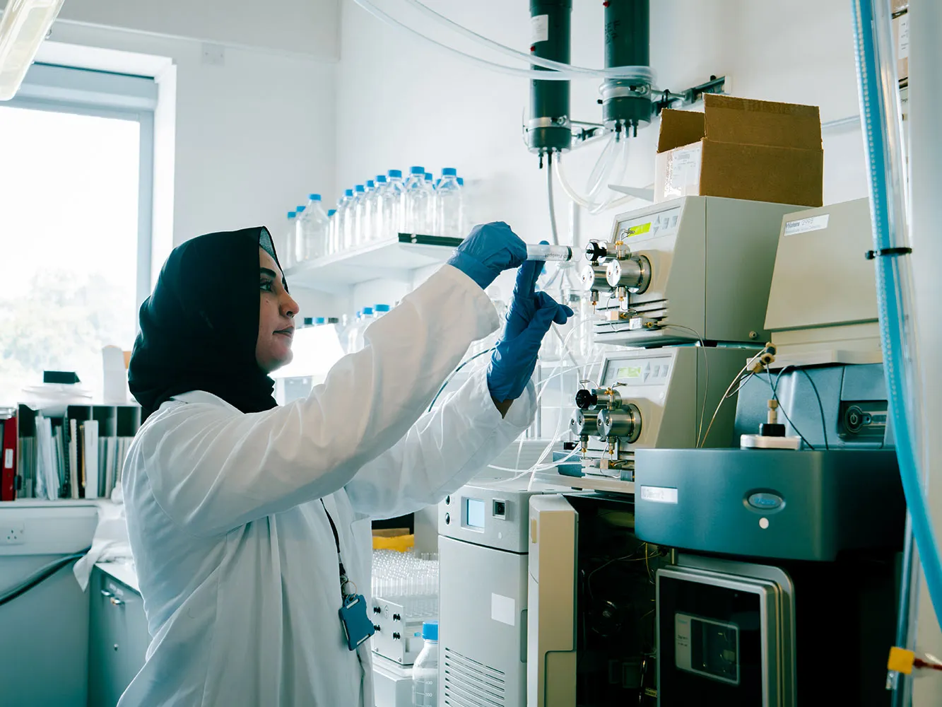 woman injecting sample into a machine