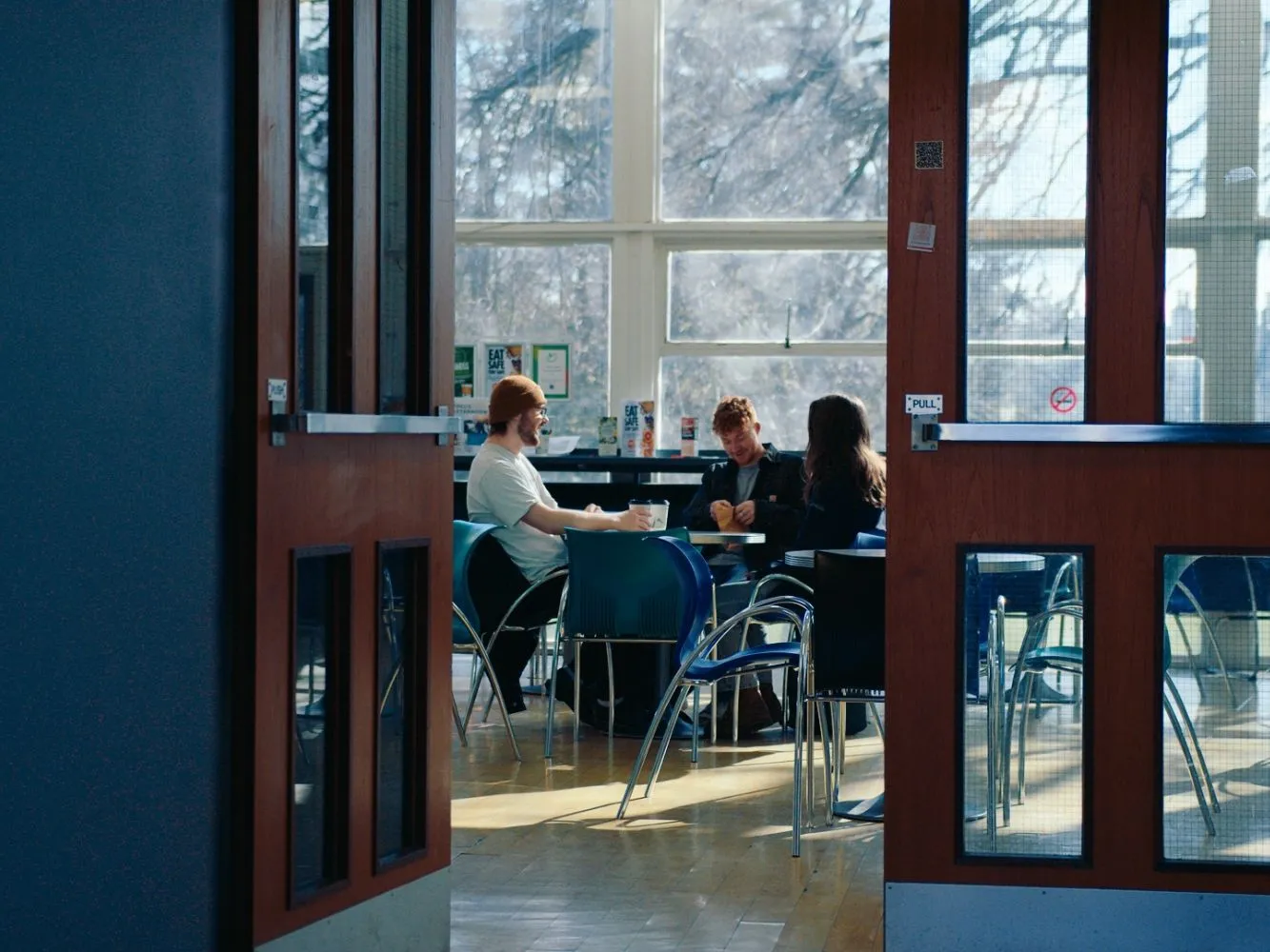 Three RGU students talking together