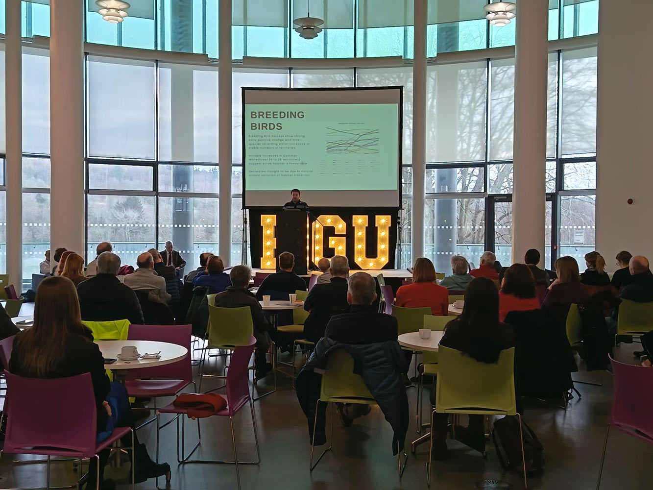 Community Update Event an audience watching a presentation the atrium at RGU