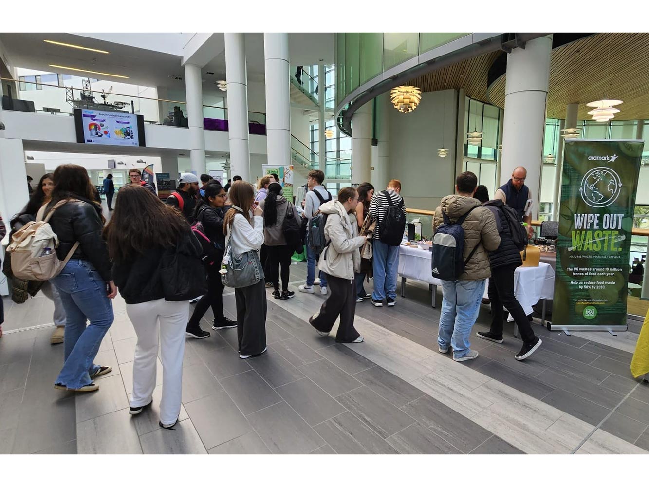 Our Campus Our World people walking around at an event in the Sir Ian Wood Building