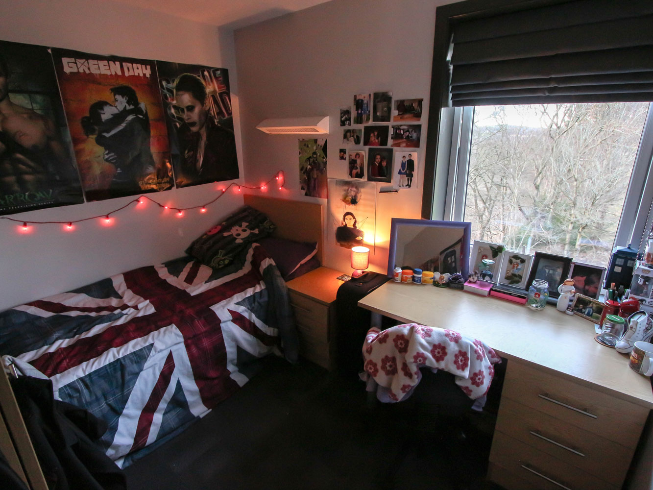 Decorated bedroom with single bed and desk