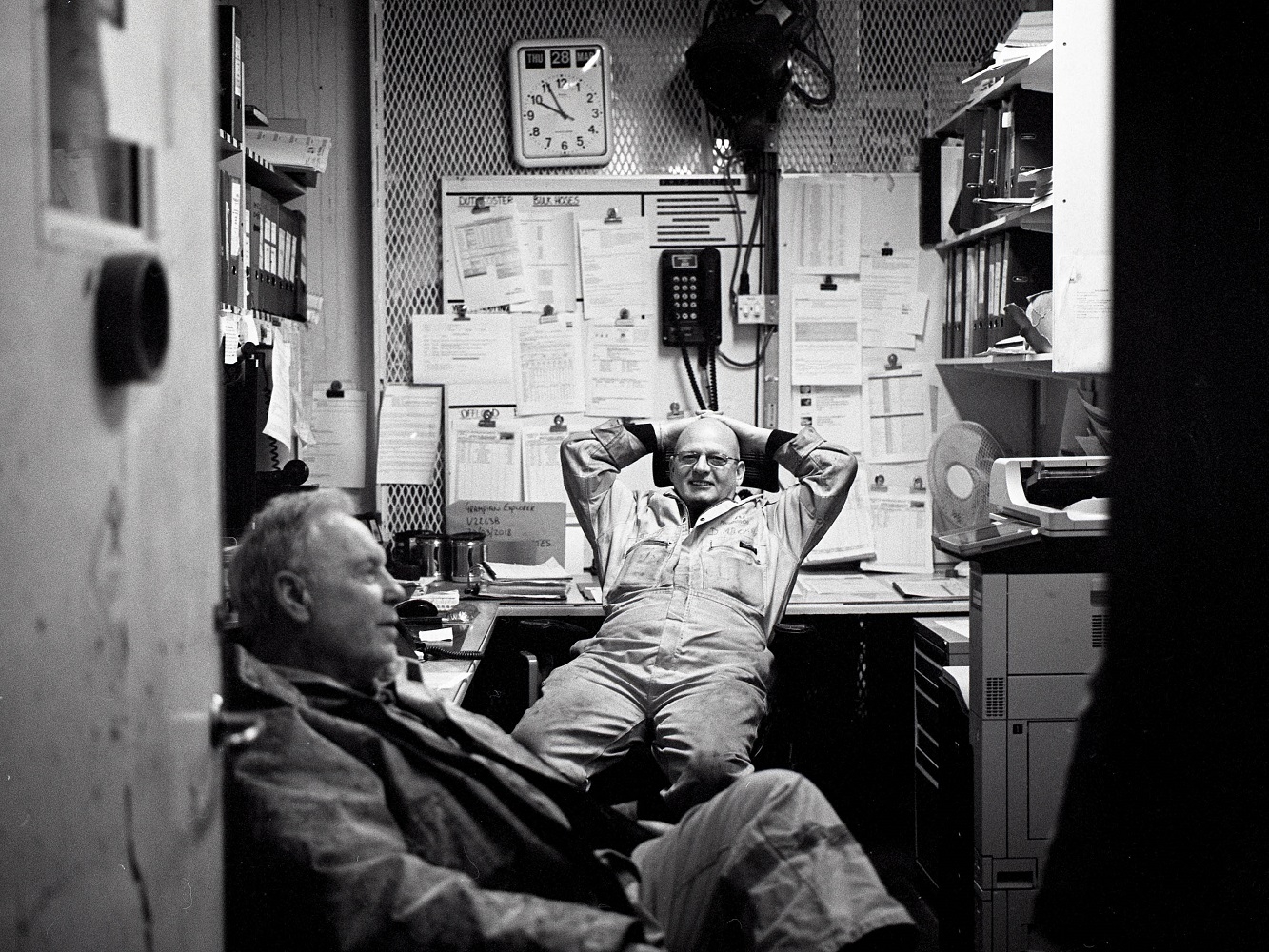 Two platform workers relaxing in an office space
