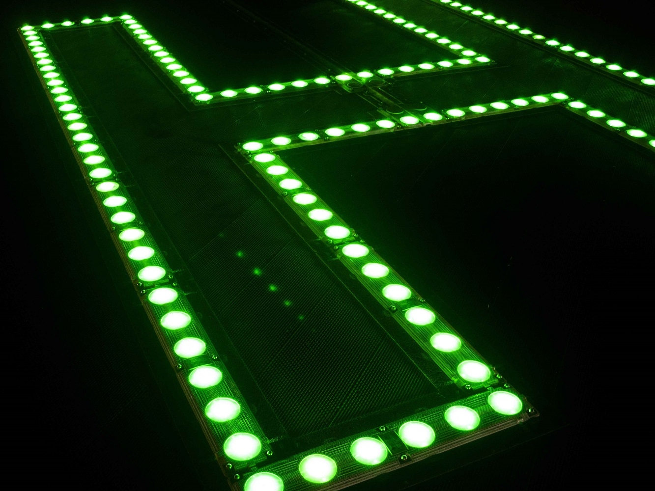Helicopter landing pad lit up by green lights