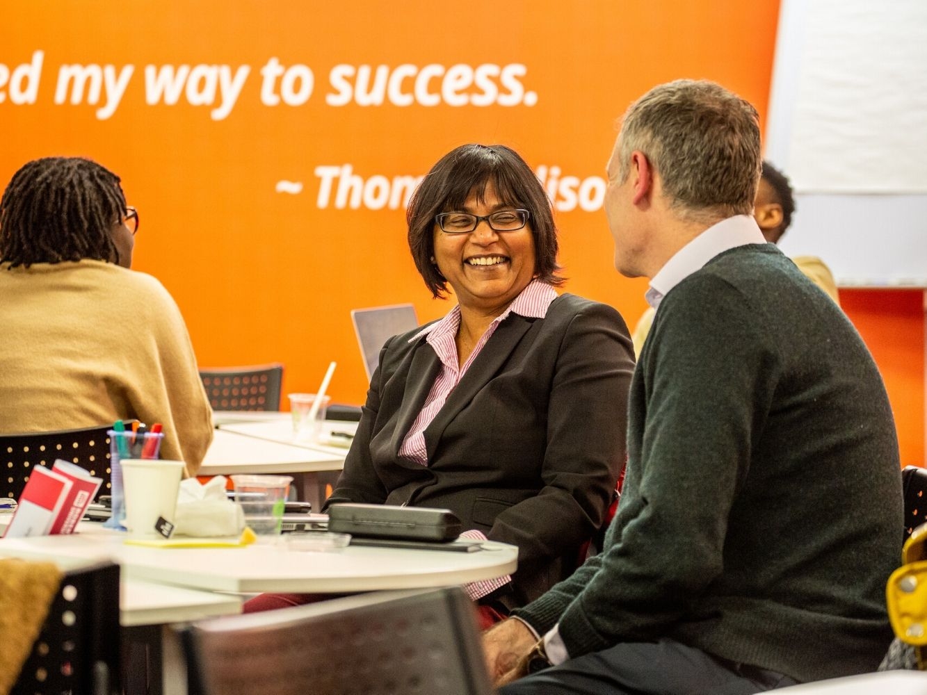Two people sat at a table taking part in Start Up Accelerator Programme