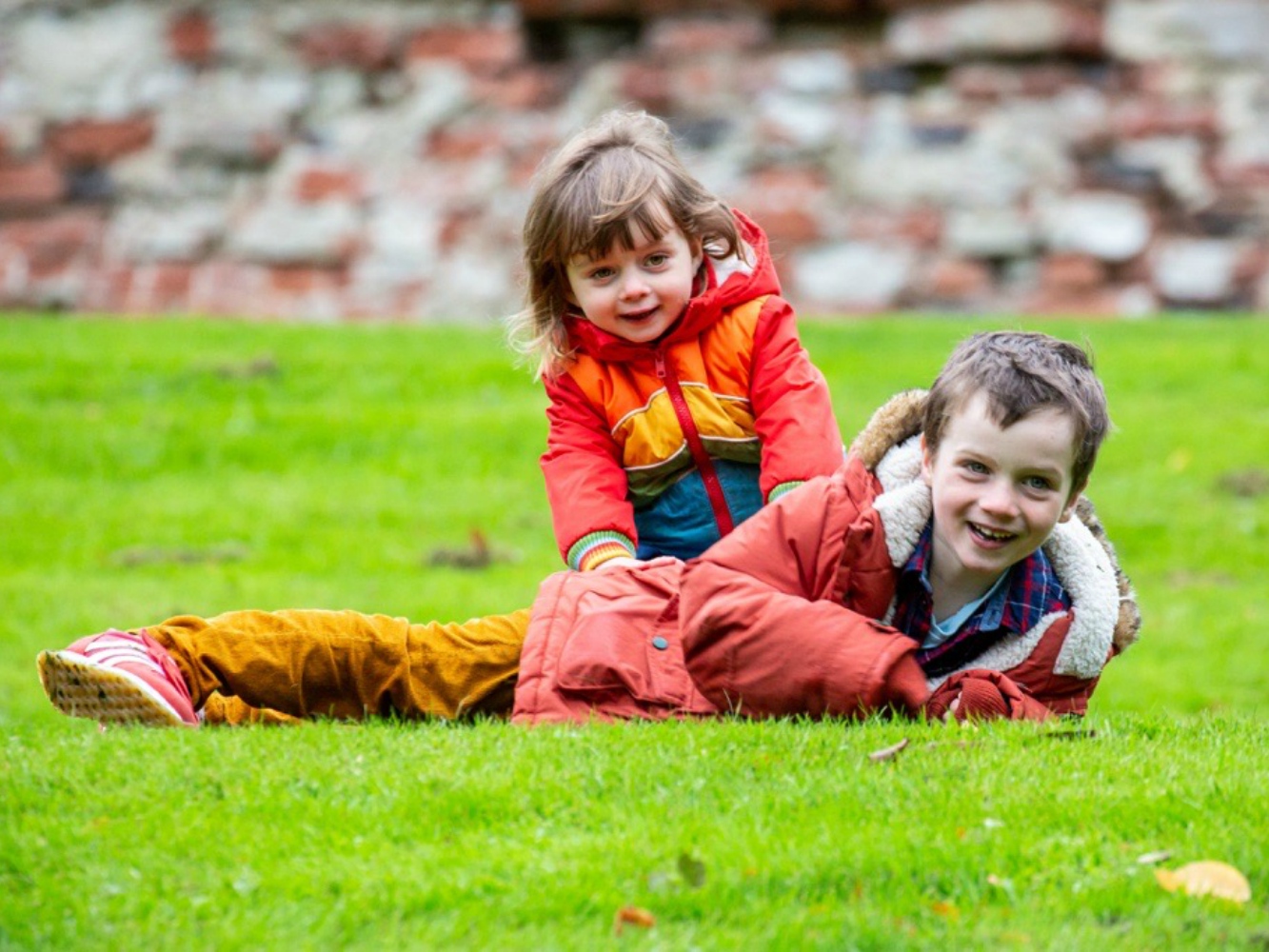 Helen Castle's two children playing outdoors