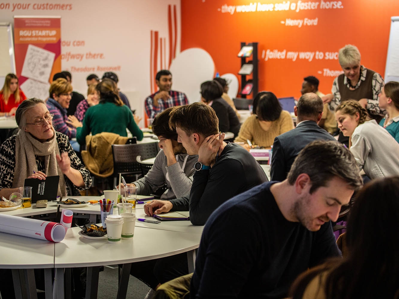 Groups of people in conversation at RGU Innovation Station