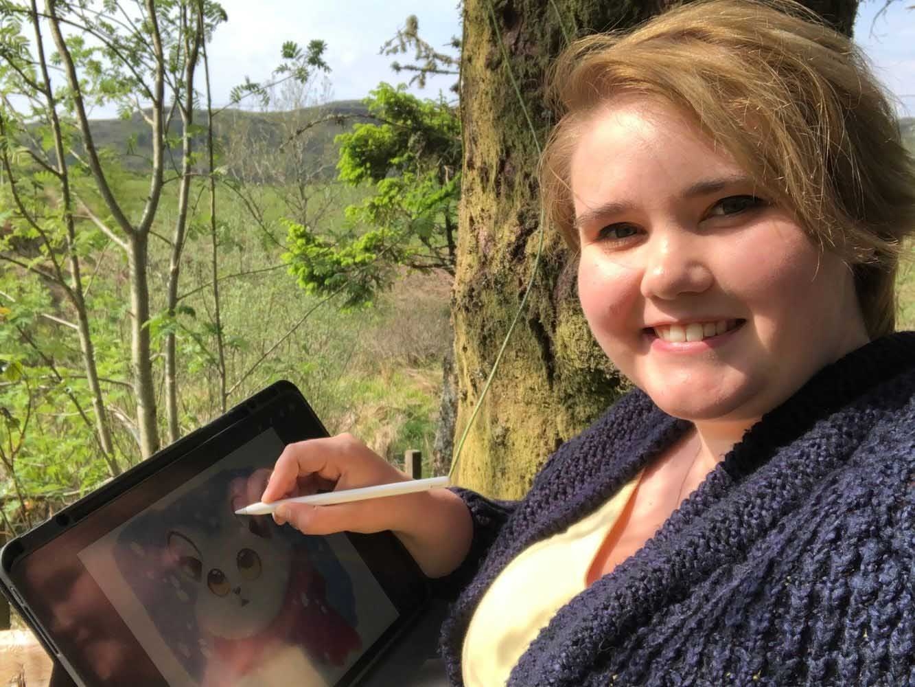 Leanne-Daphne Goodall creating a digital drawing on an iPad