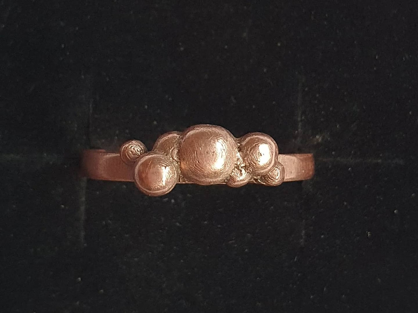 Copper ring with band and multiple spheres on top