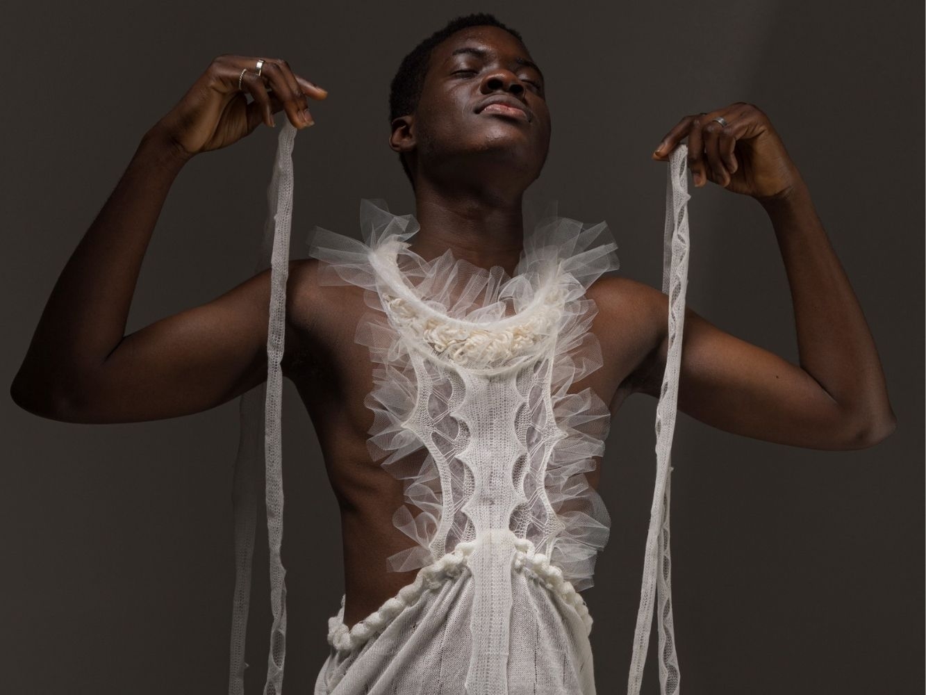 Knitted clothing item worn by model, designed to look like a marine organism