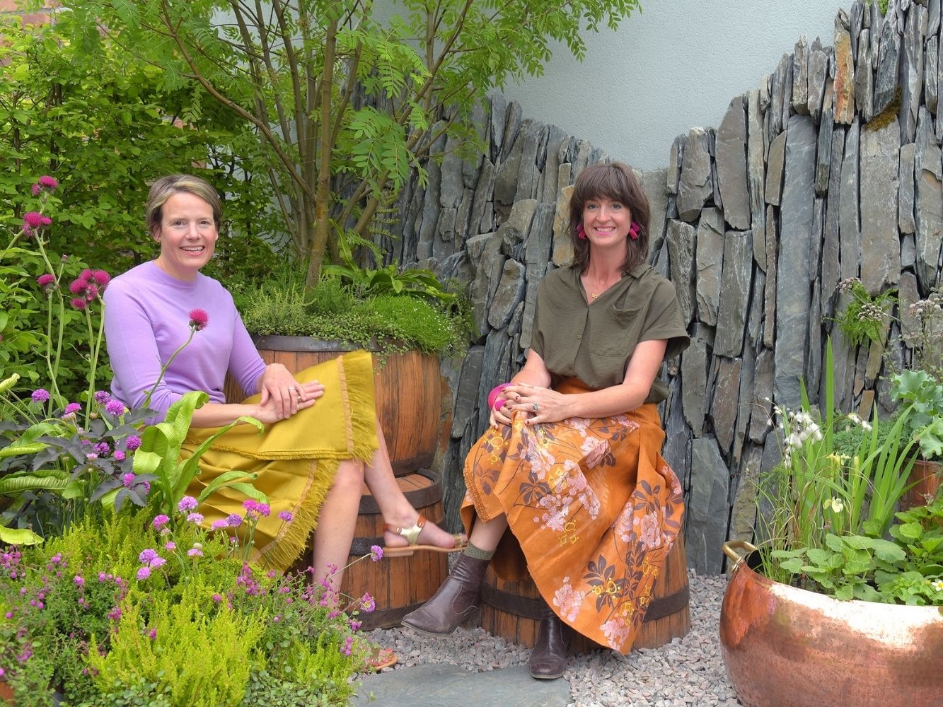 Andrea Chappell and Jane Porter pose in garden