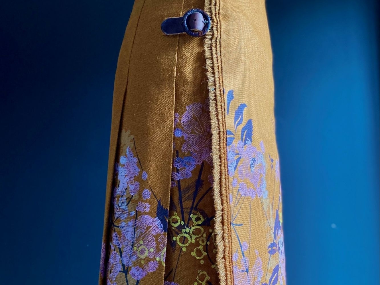 Close up on flower print detailing on skirt