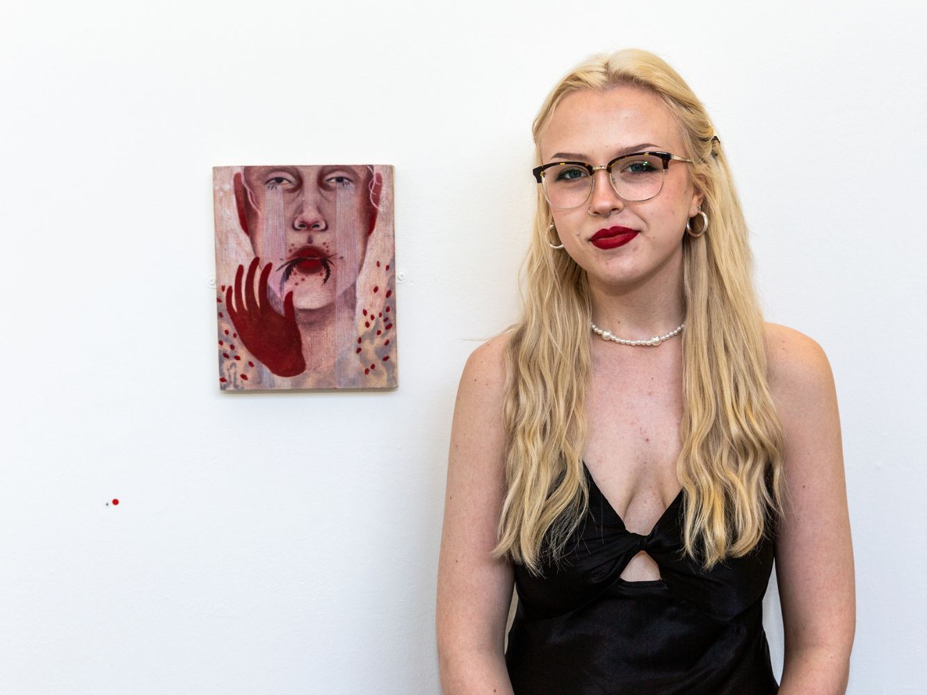 Hannah Cutt poses with artwork
