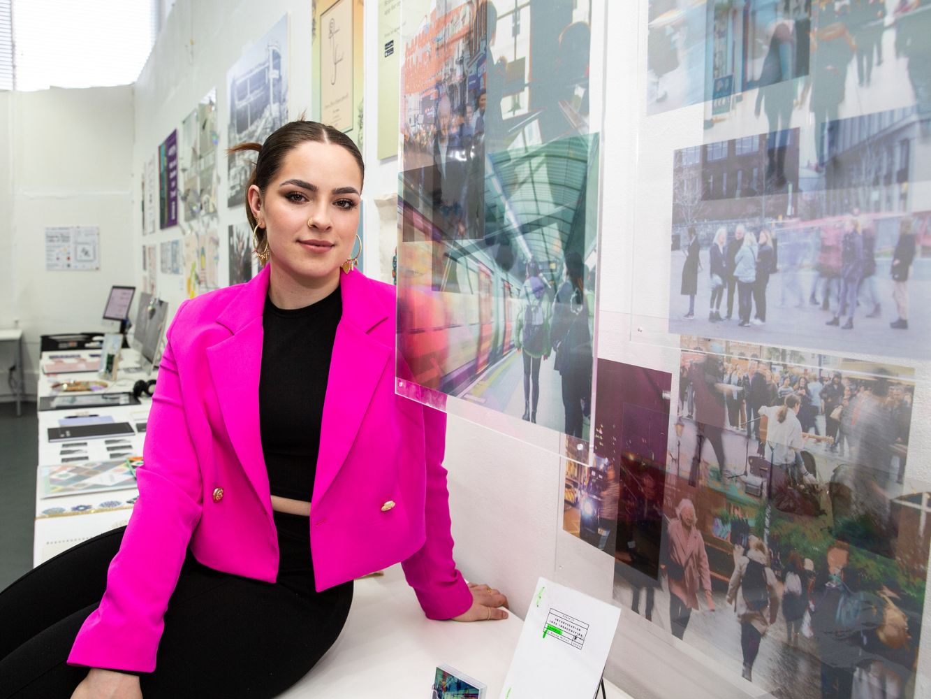 Sasha Miller poses with artwork-