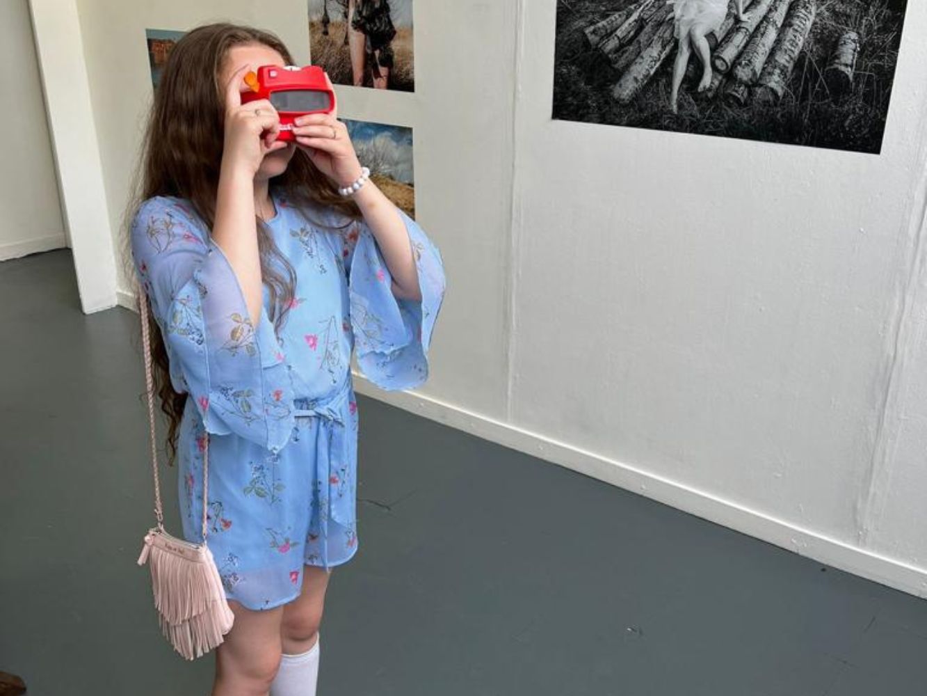 Kitty Donovan interacts with objects in the gallery