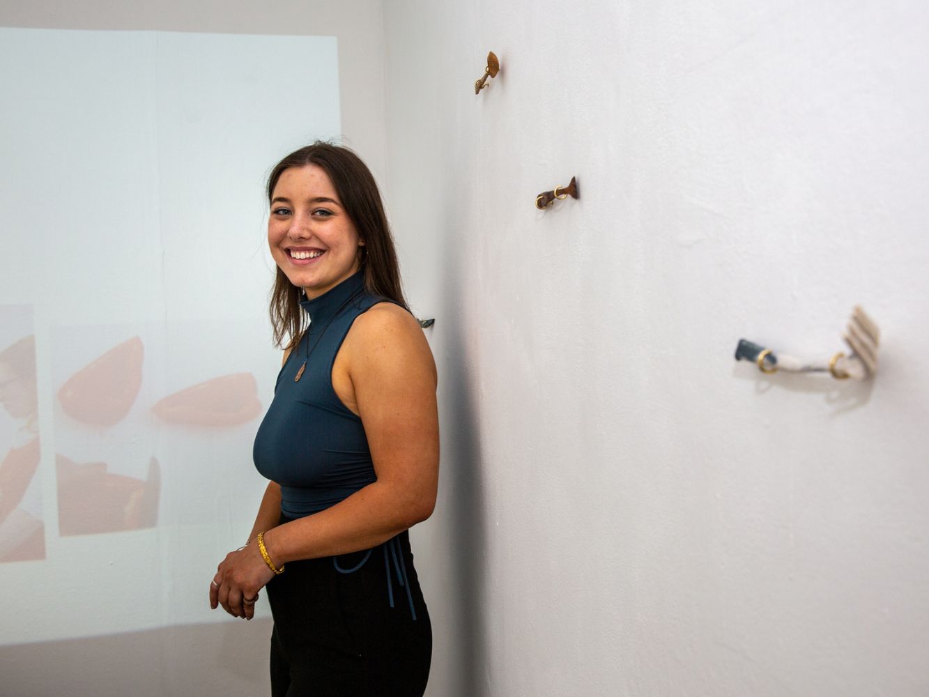 Carla Smith poses with artwork