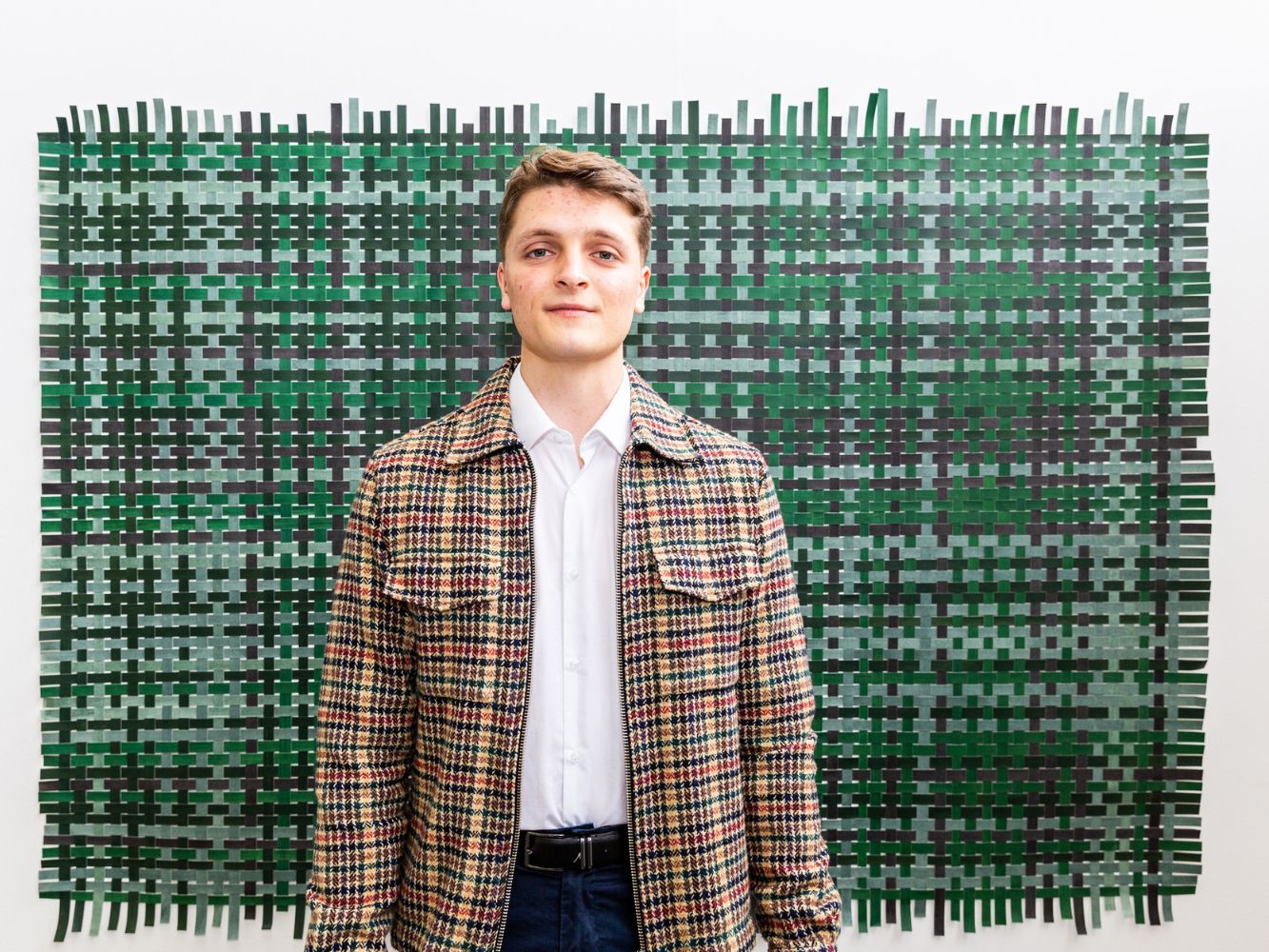 Ian McFadzean poses with artwork