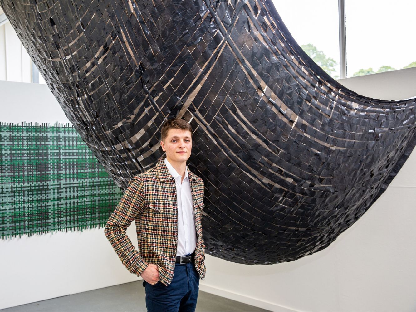 Ian McFadzean poses with artwork