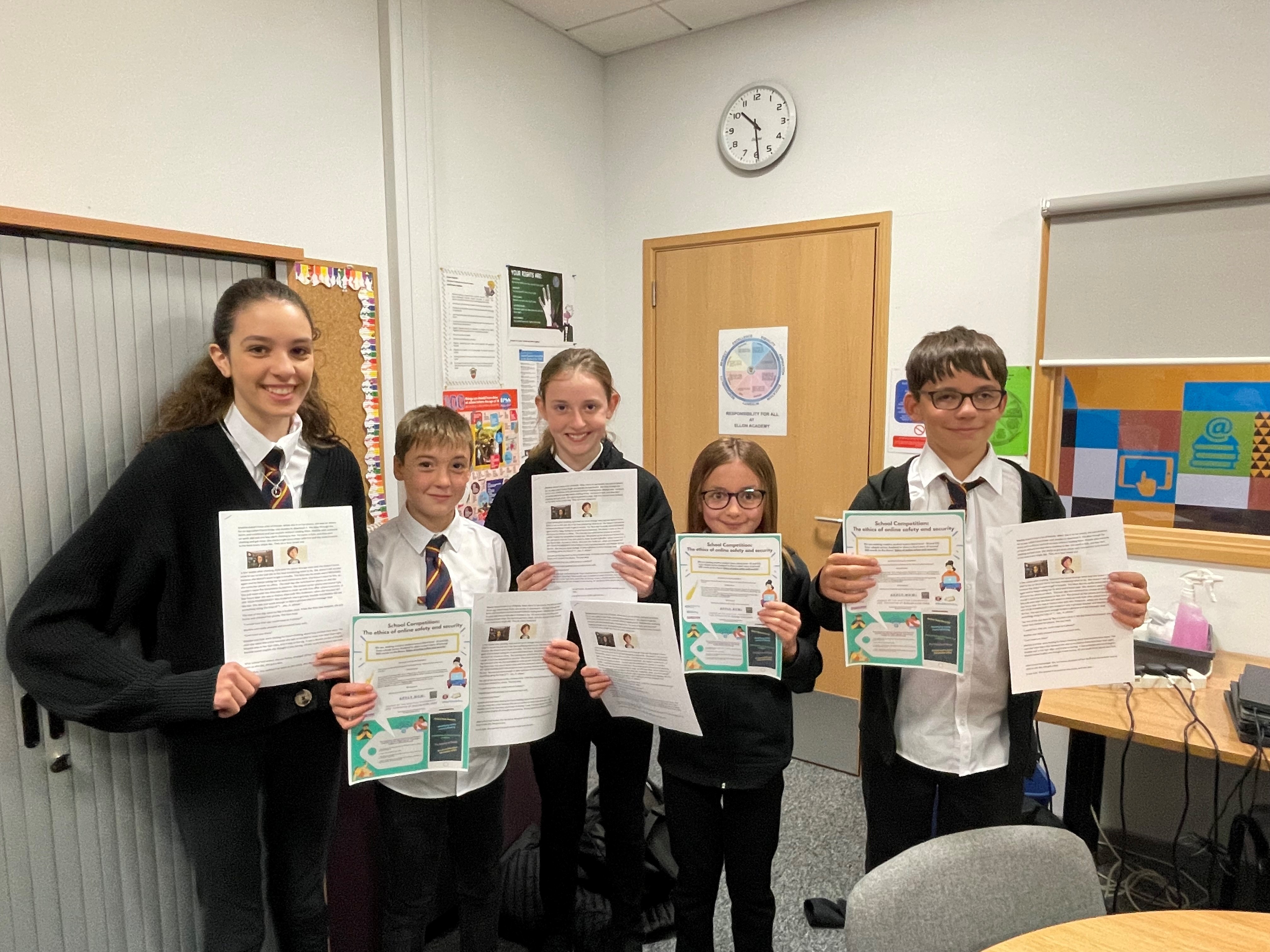 Ellon Academy Maddie-is Online story writing winners pose with stories