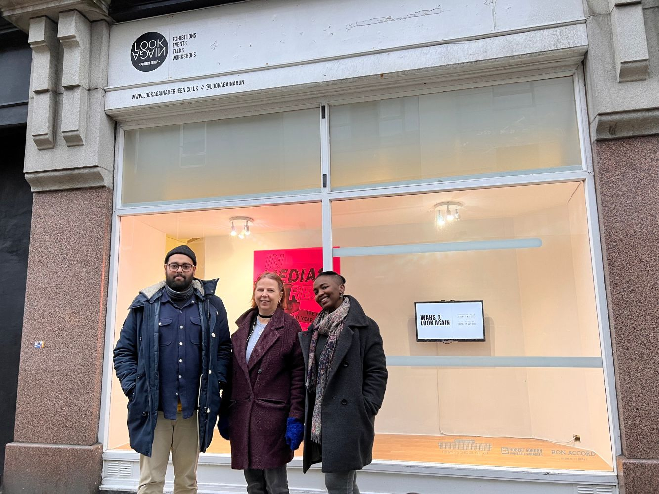 Artists selected for We Are Here Scotland Look Again Project stand outside creative unit