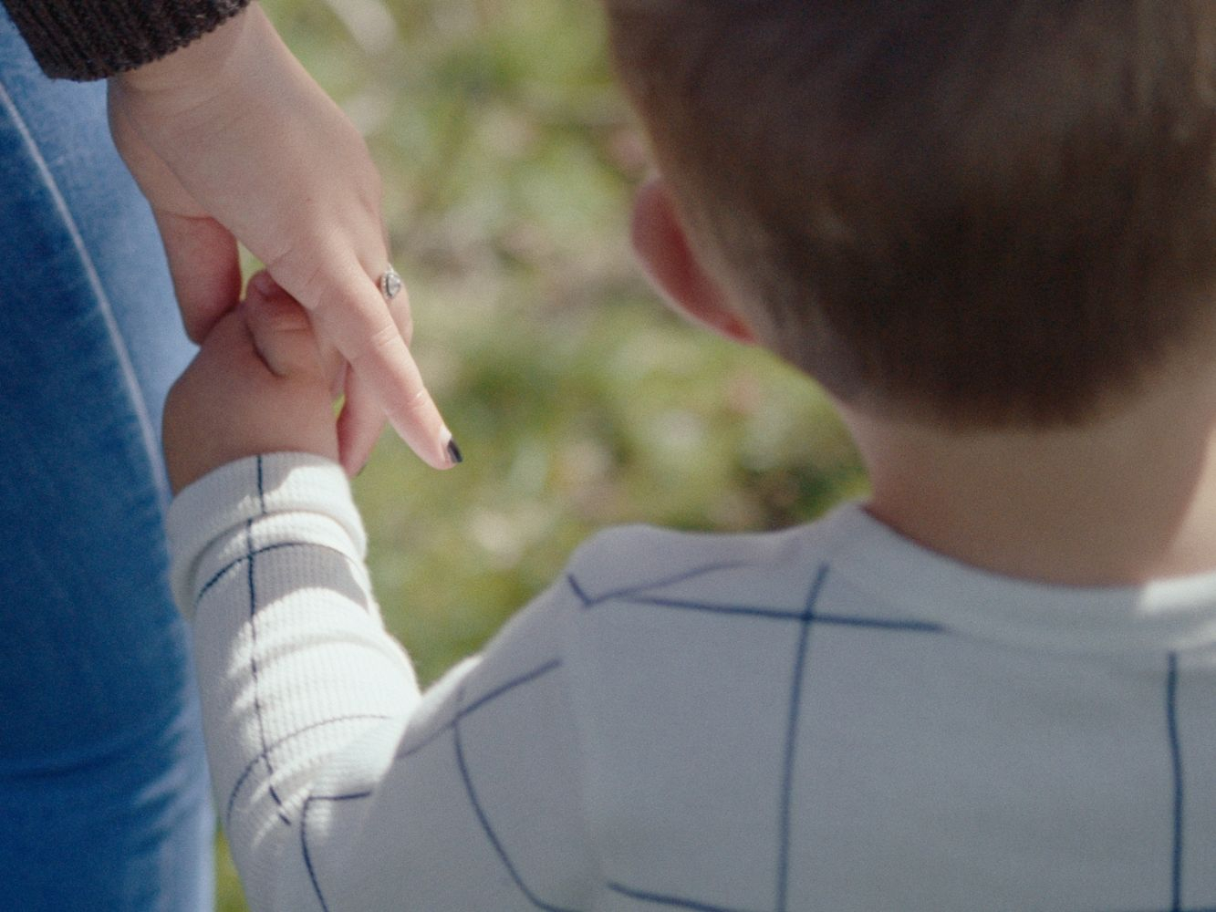 Mother and child holding hands