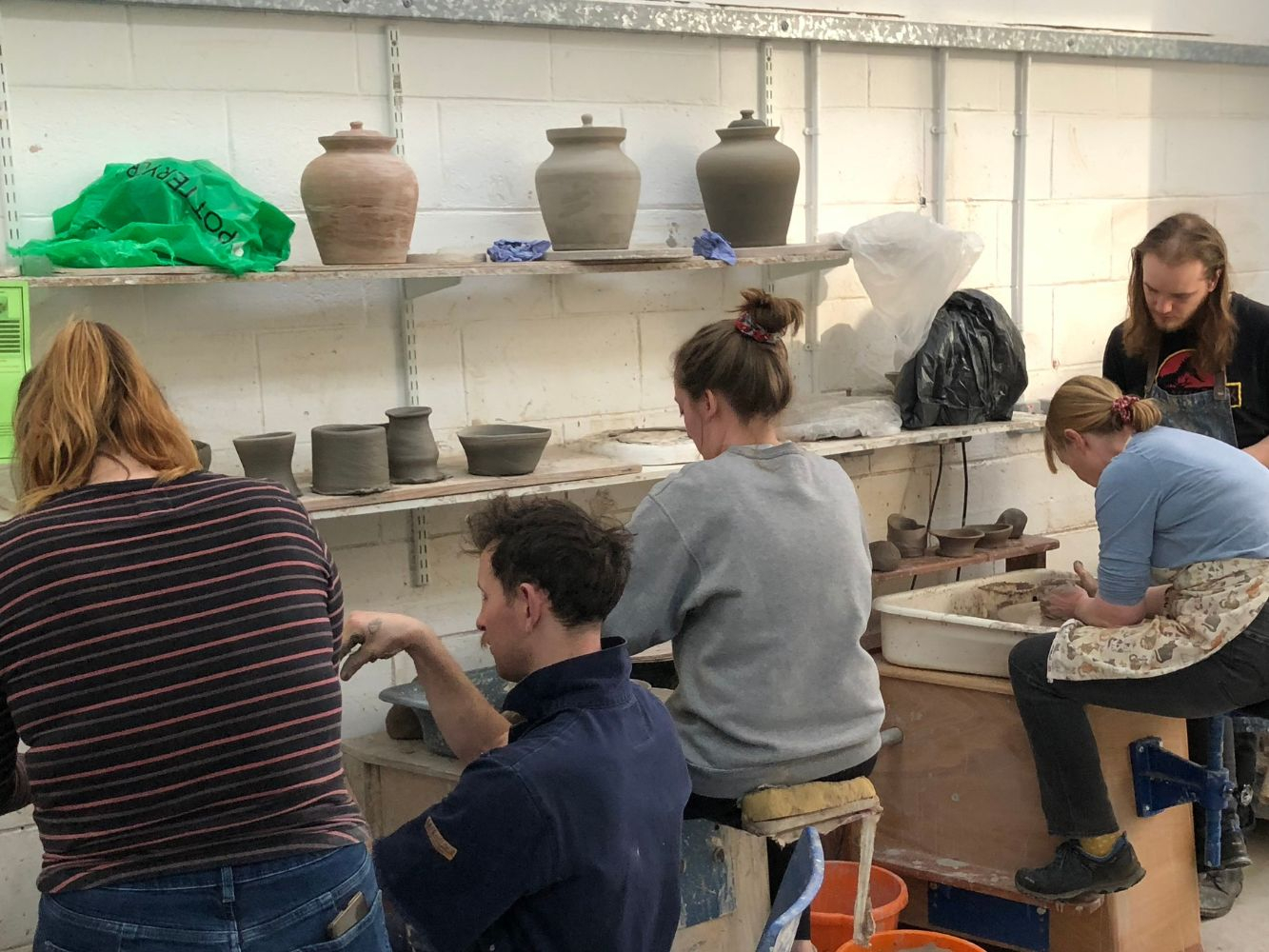 People trying pottery