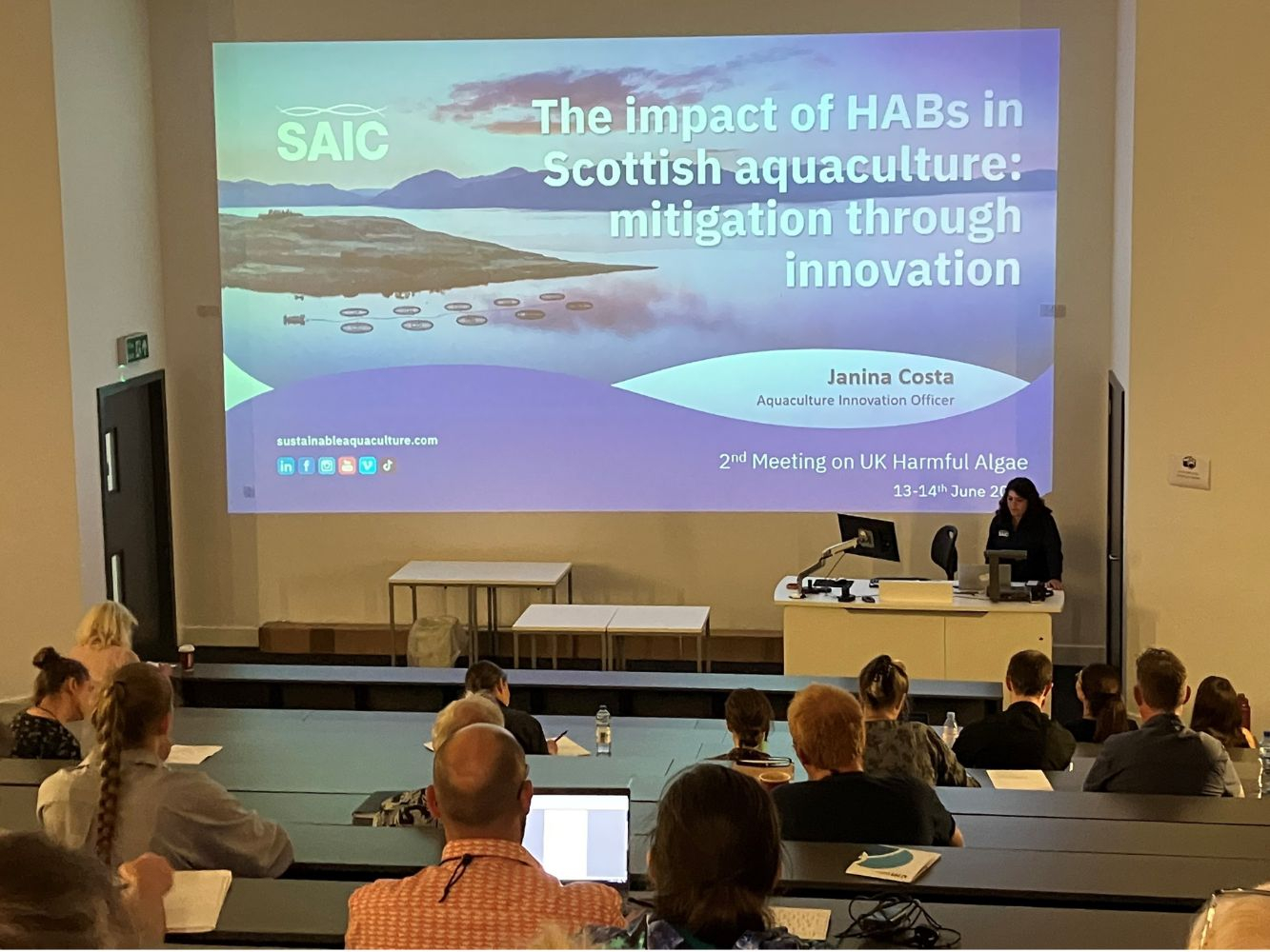 A PPT slide in lecture theatre on impact of harmful algae