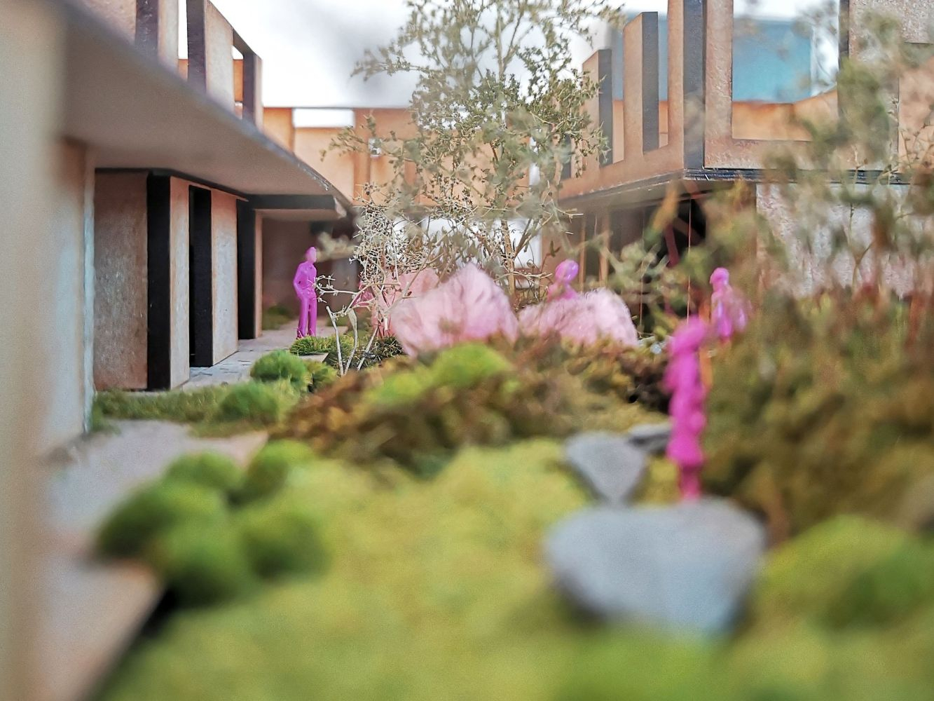 close up of greenery and trees in small architectural wooden model